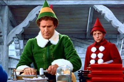 Will Ferrell as Elf with Papa Elf in the background