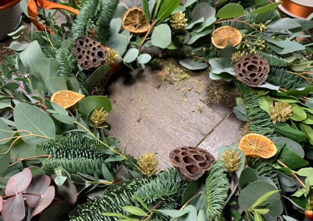 Christmas wreath with oranges and pine cones
