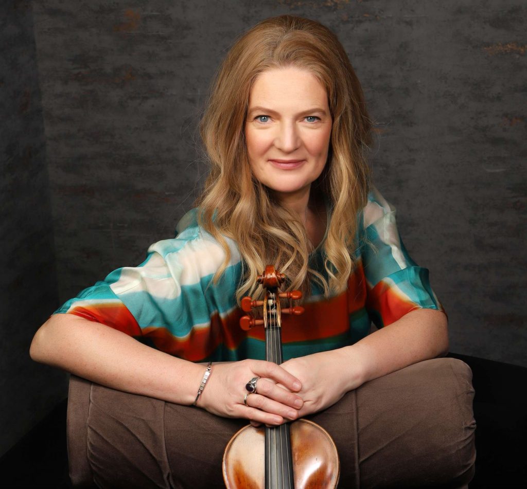 Headshot of Rachel Podger with violin
