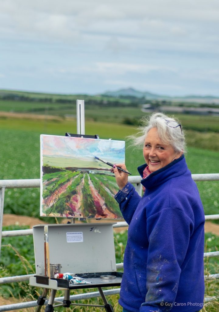 Sarah Jane Brown painting in bluer jacked